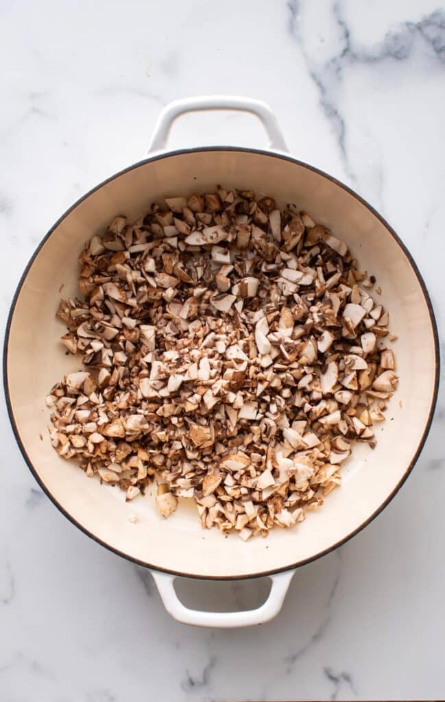 the mushrooms added to the pan.