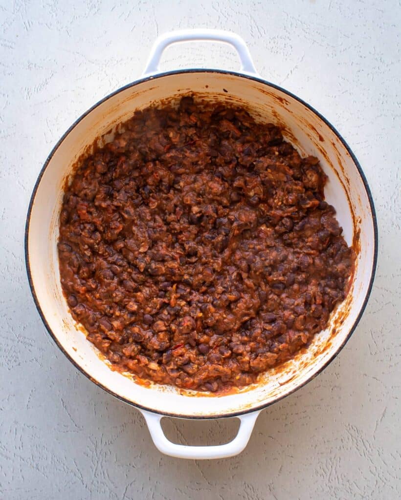 the mashed beans in the pan.