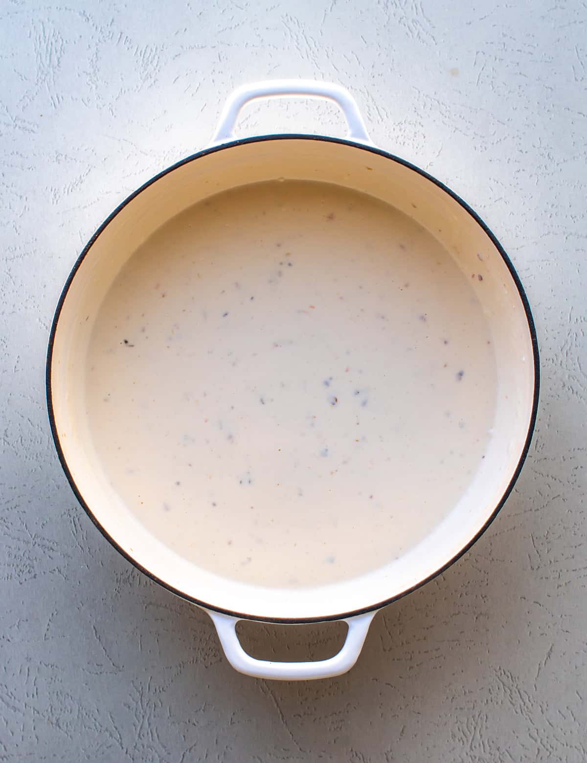 the cheese sauce in the pan.