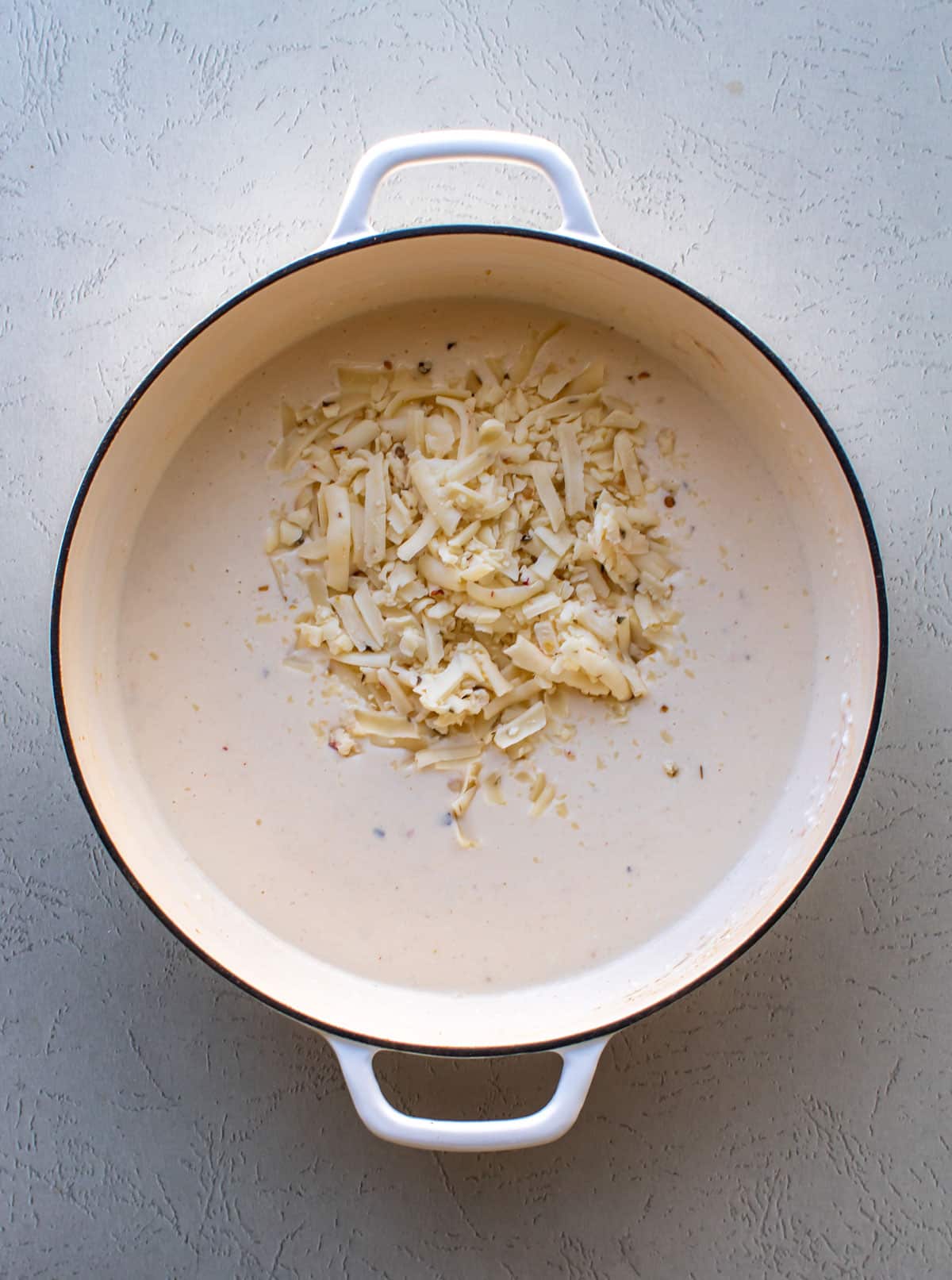 the shredded cheese added to the sauce.