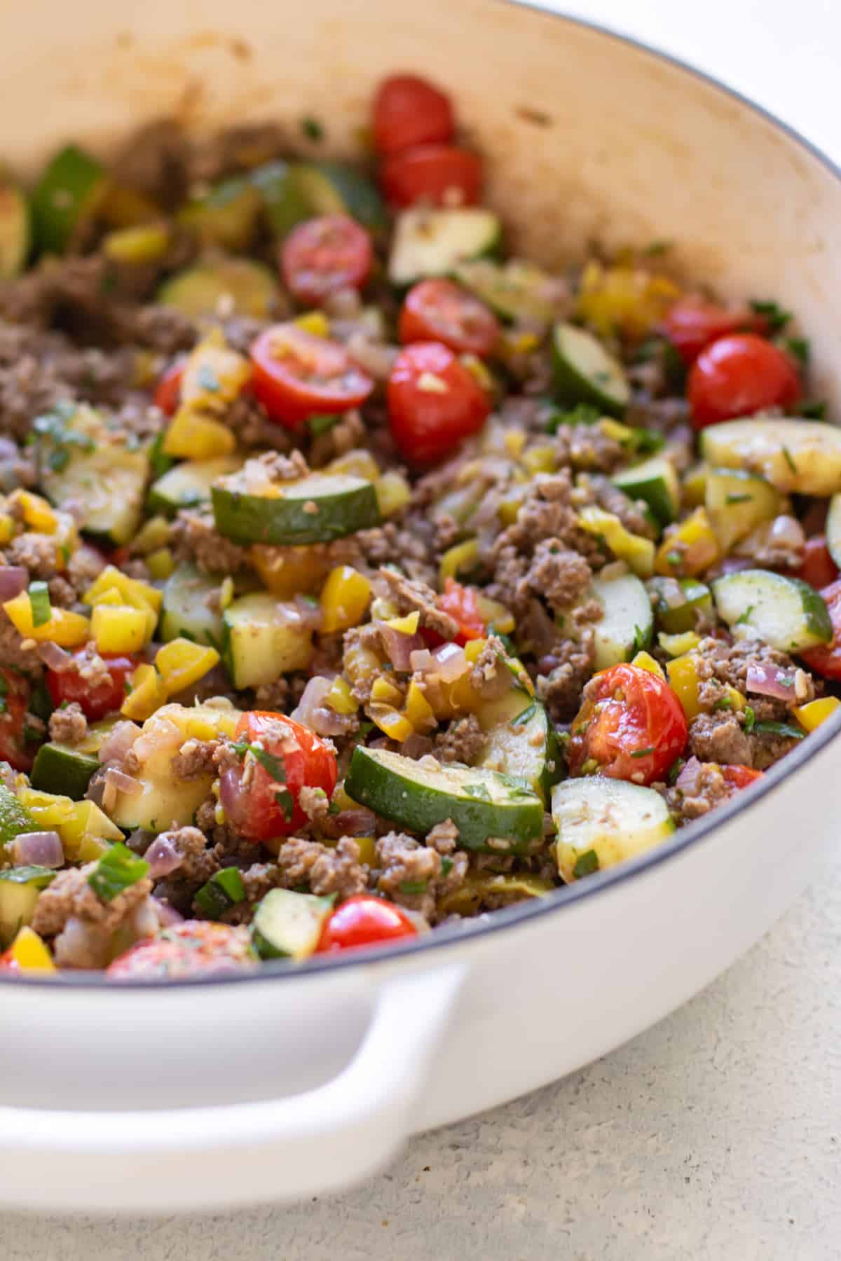 the beef and vegetables in a pan.