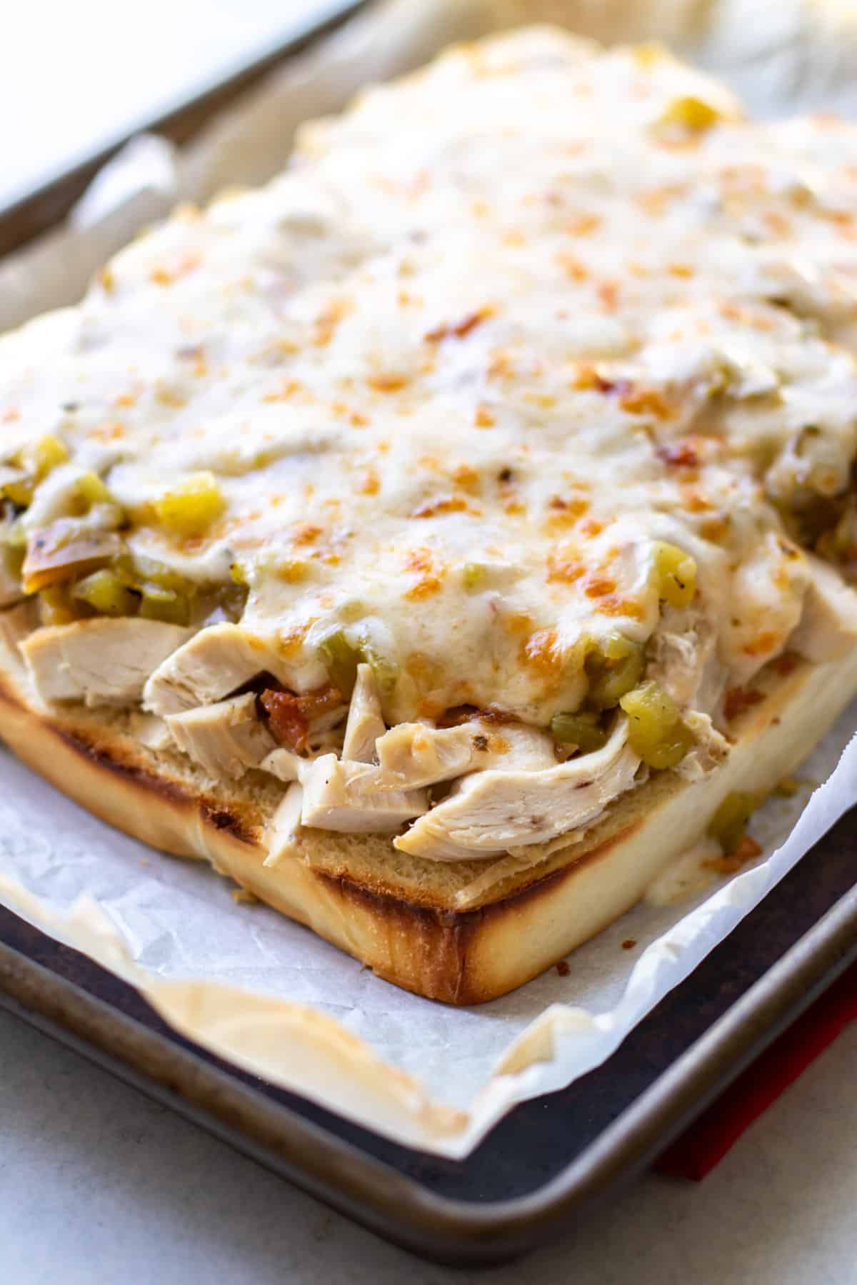 the melted cheese on top of the turkey and green chile.