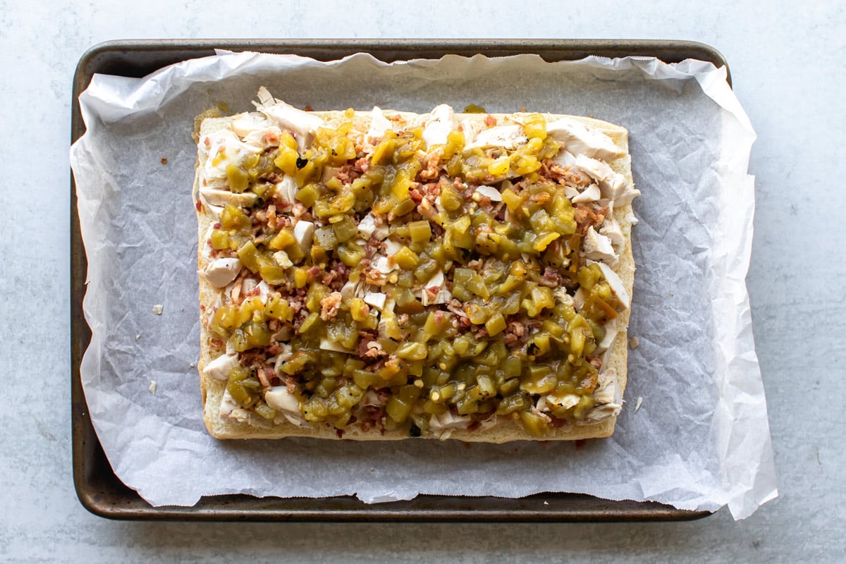 the green chile on top of the bacon and turkey.