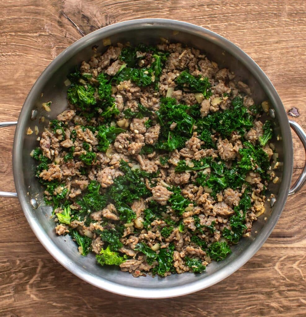 the wilted kale in the pan.