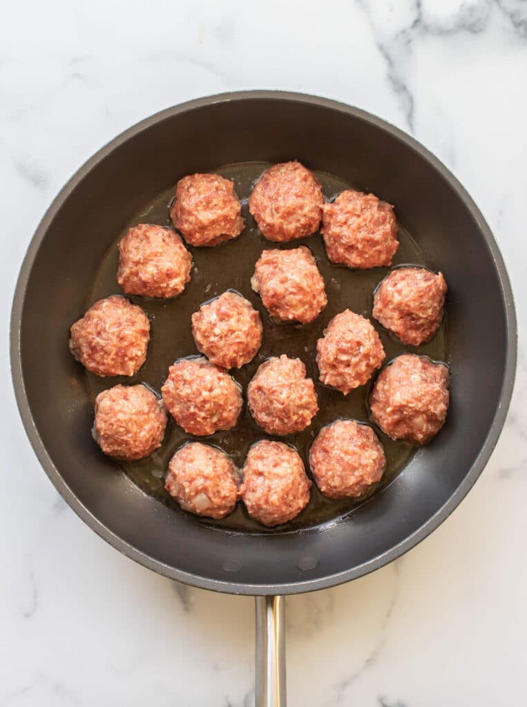 the meatballs added to the pan.