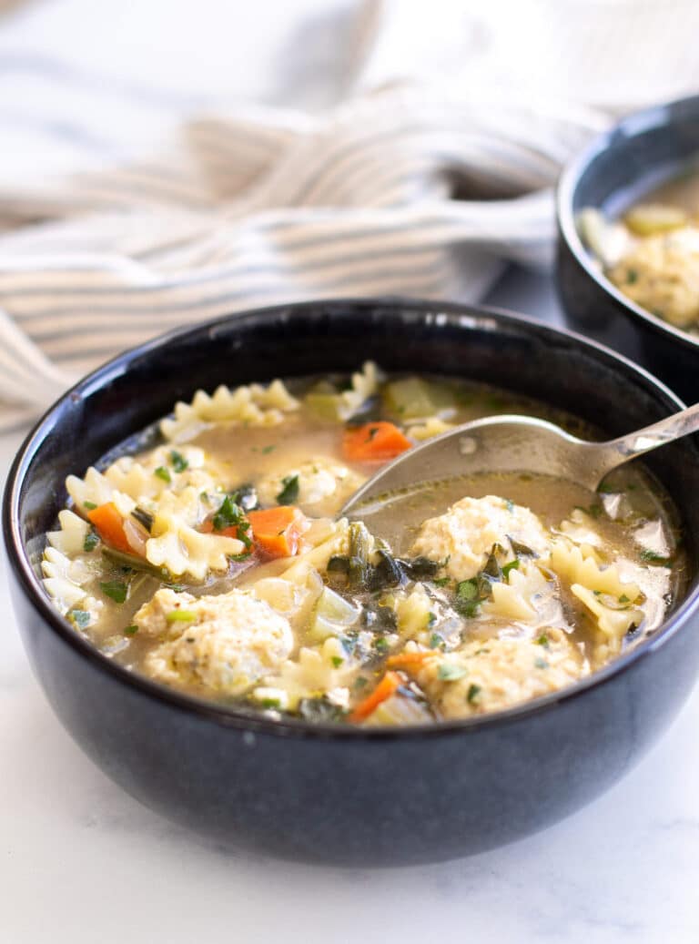 a bowl of soup with a spoon.