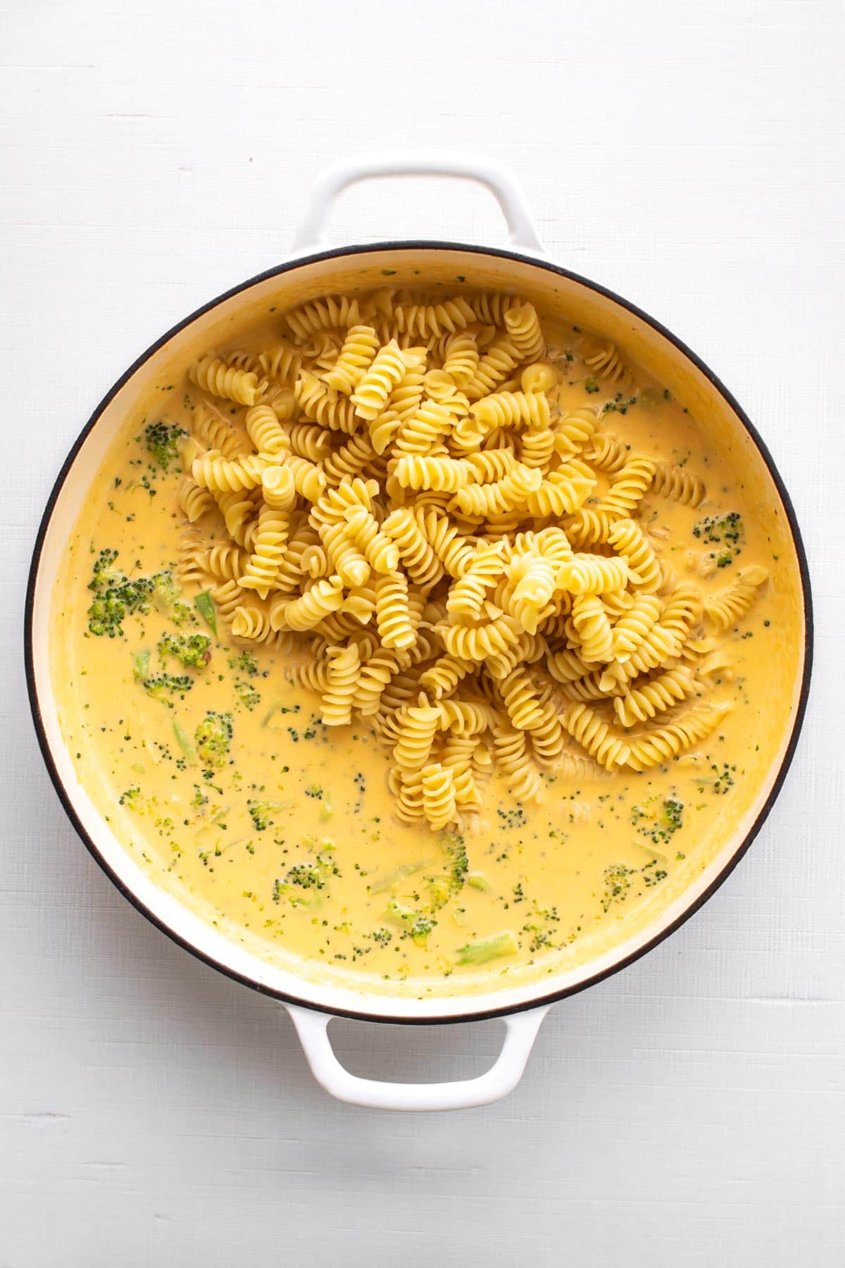 the pasta added to the sauce.