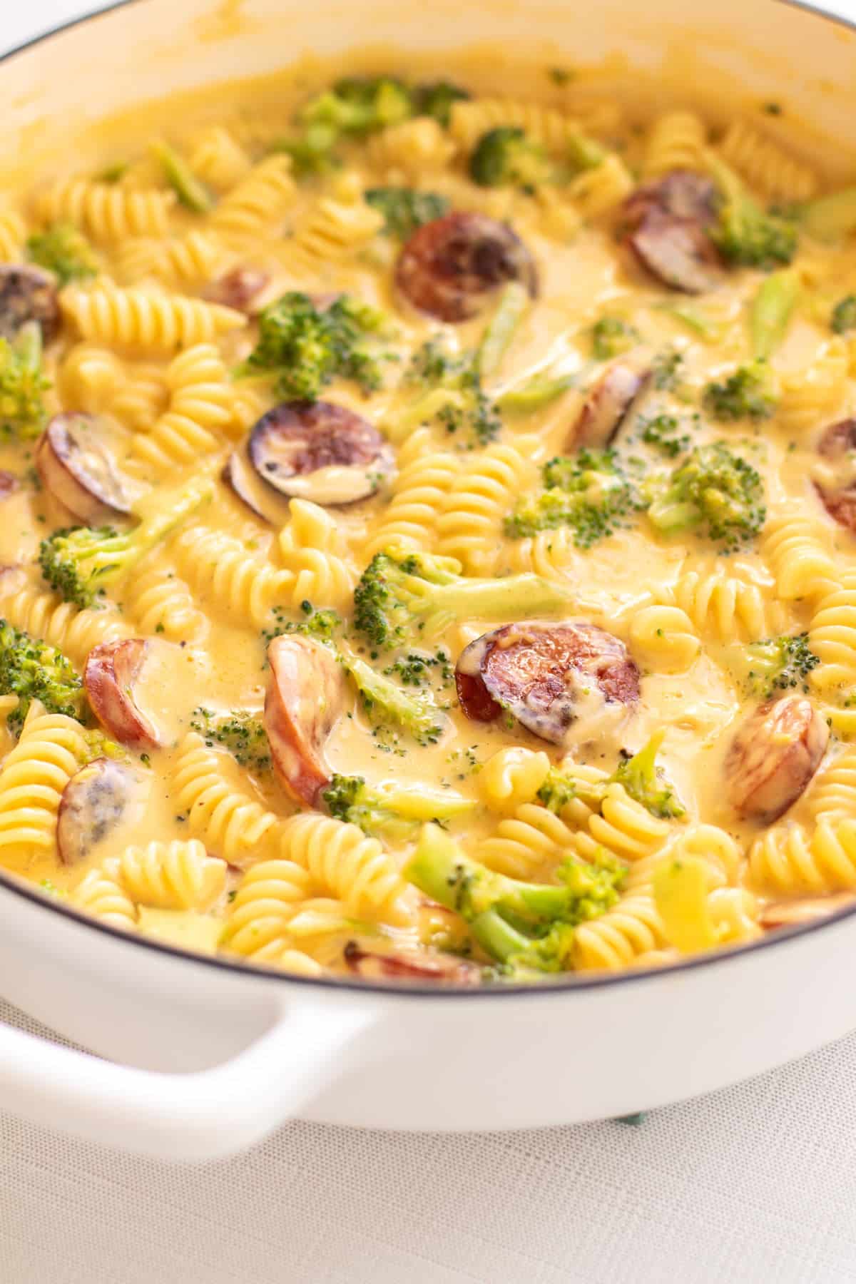 cheddar broccoli kielbasa in a pan.