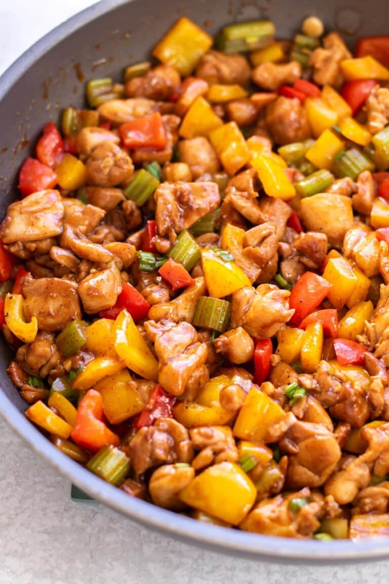 chicken stir fry in a skillet.