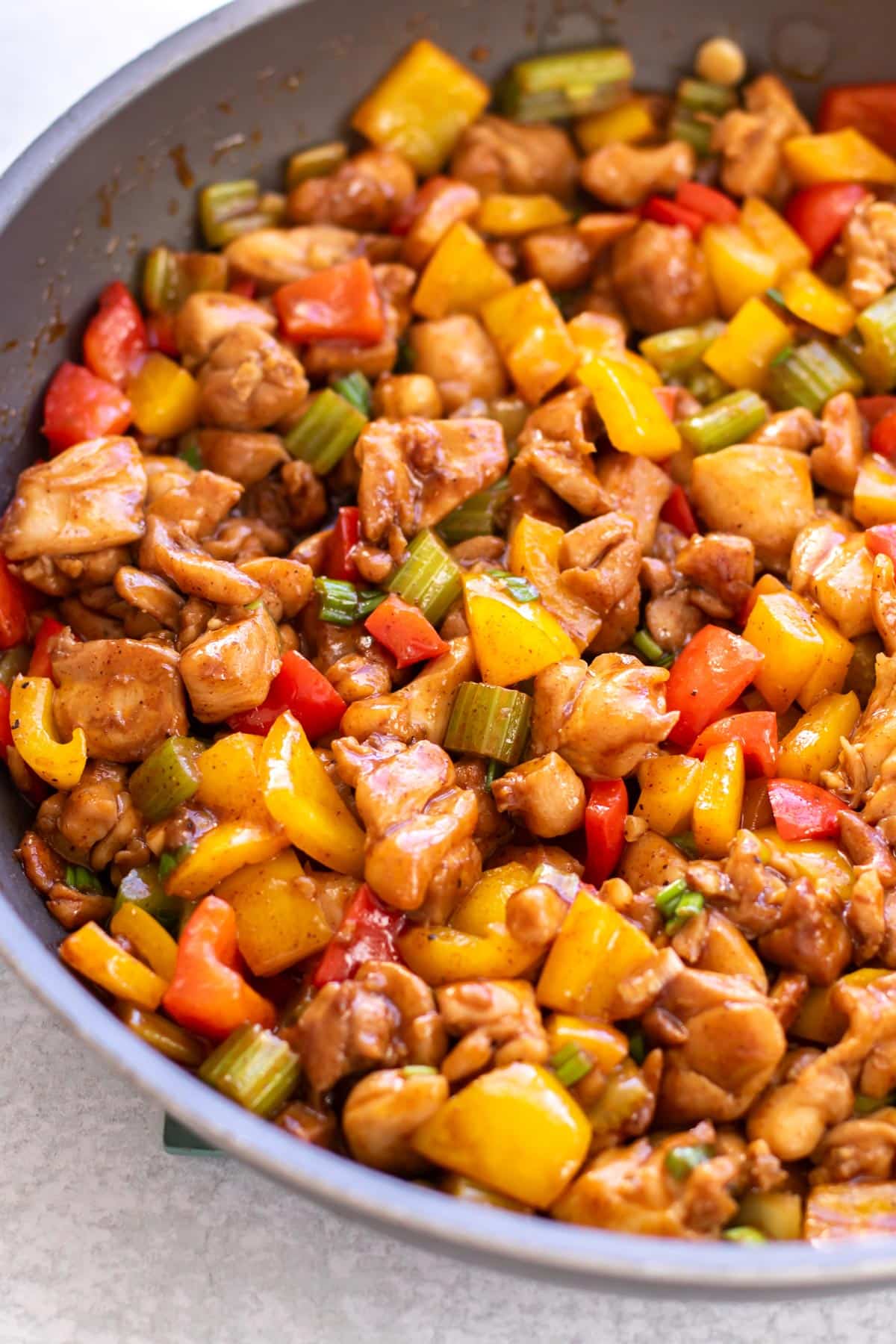 chicken stir fry in a skillet.