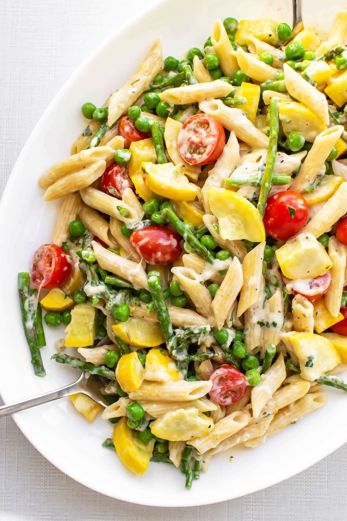 a platter with pasta primavera