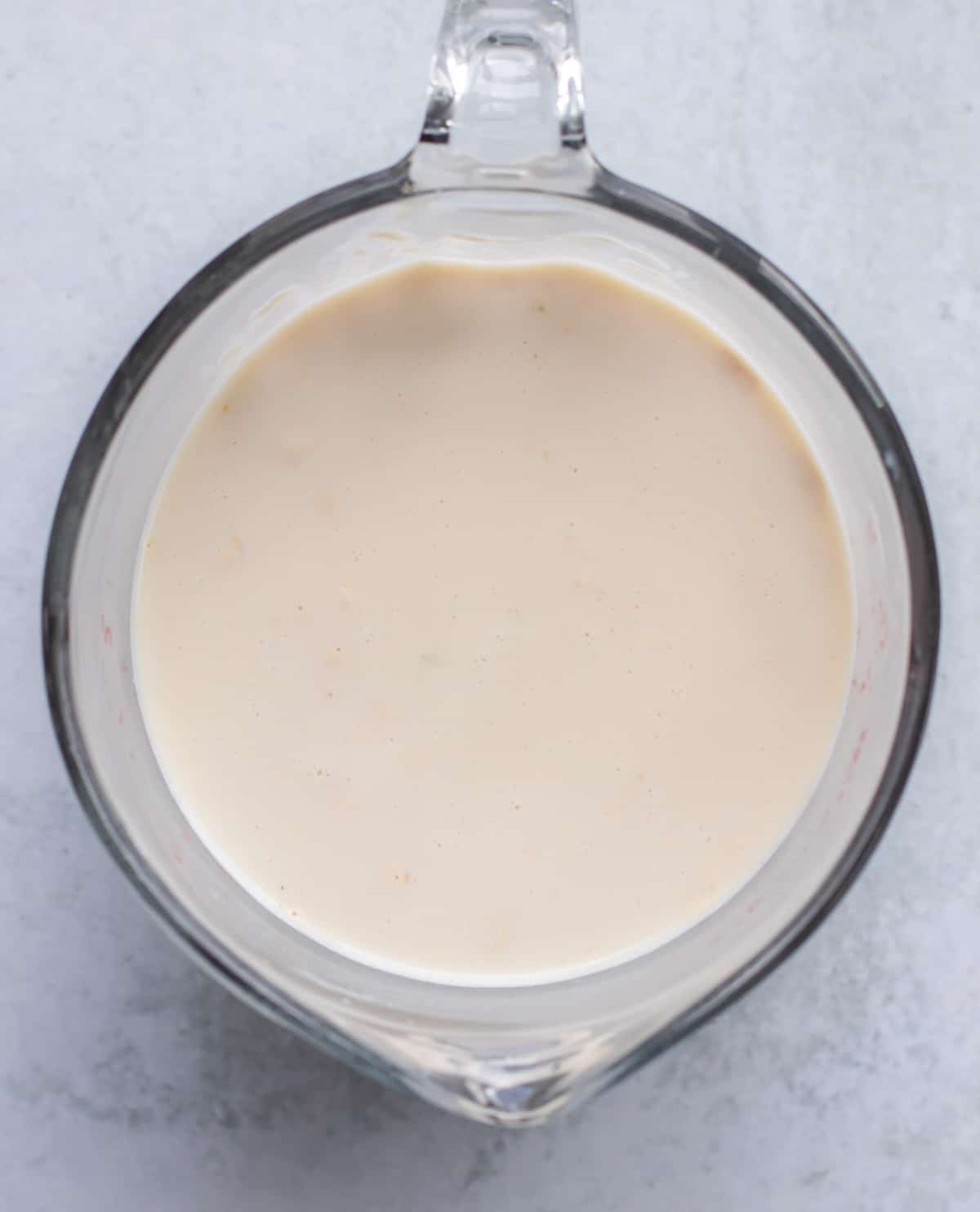 the peanut butter yogurt milk mixture in a large measuring cup.