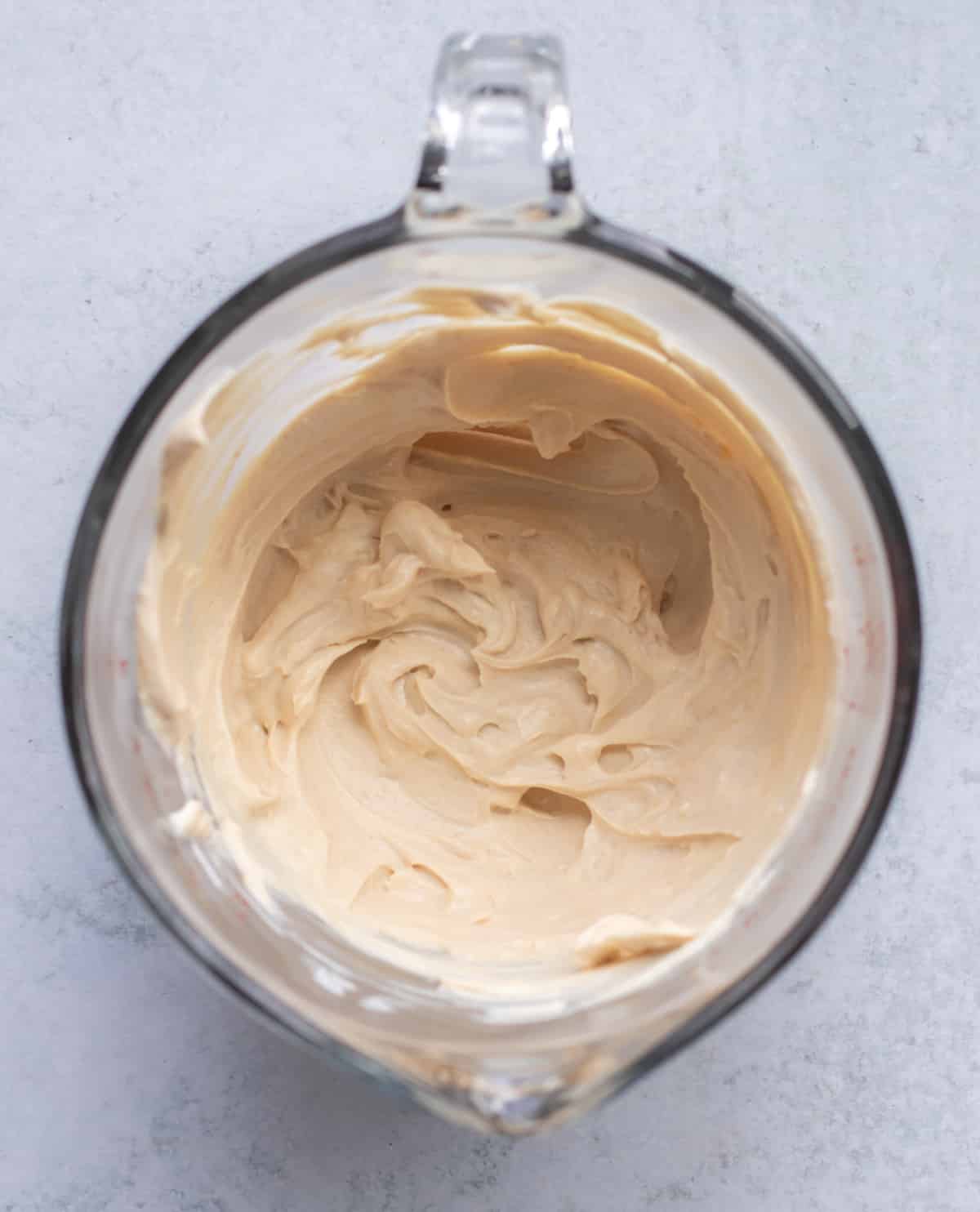 the peanut butter and yogurt mixture in a measuring cup.