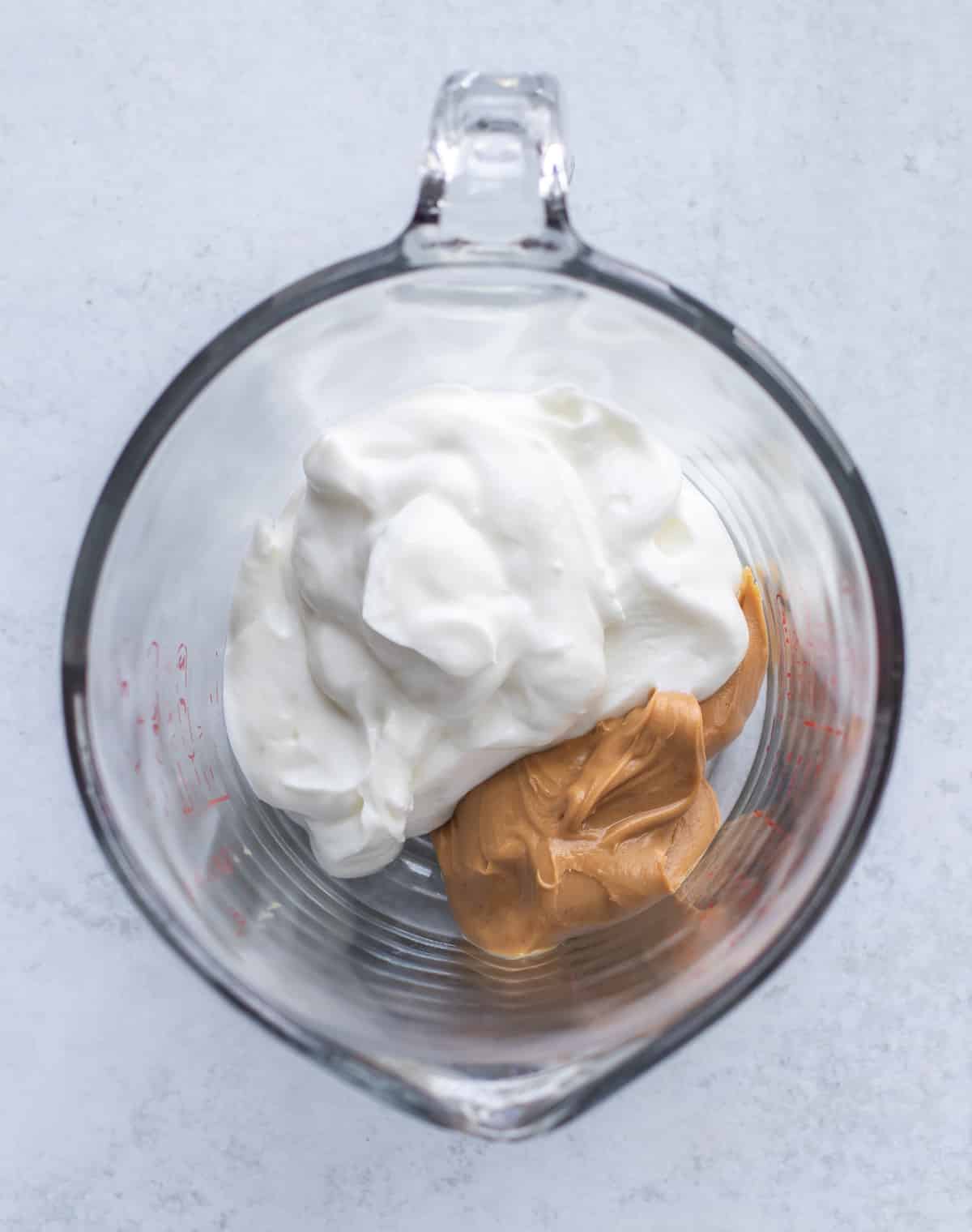 the yogurt and peanut butter ready to be mixed.